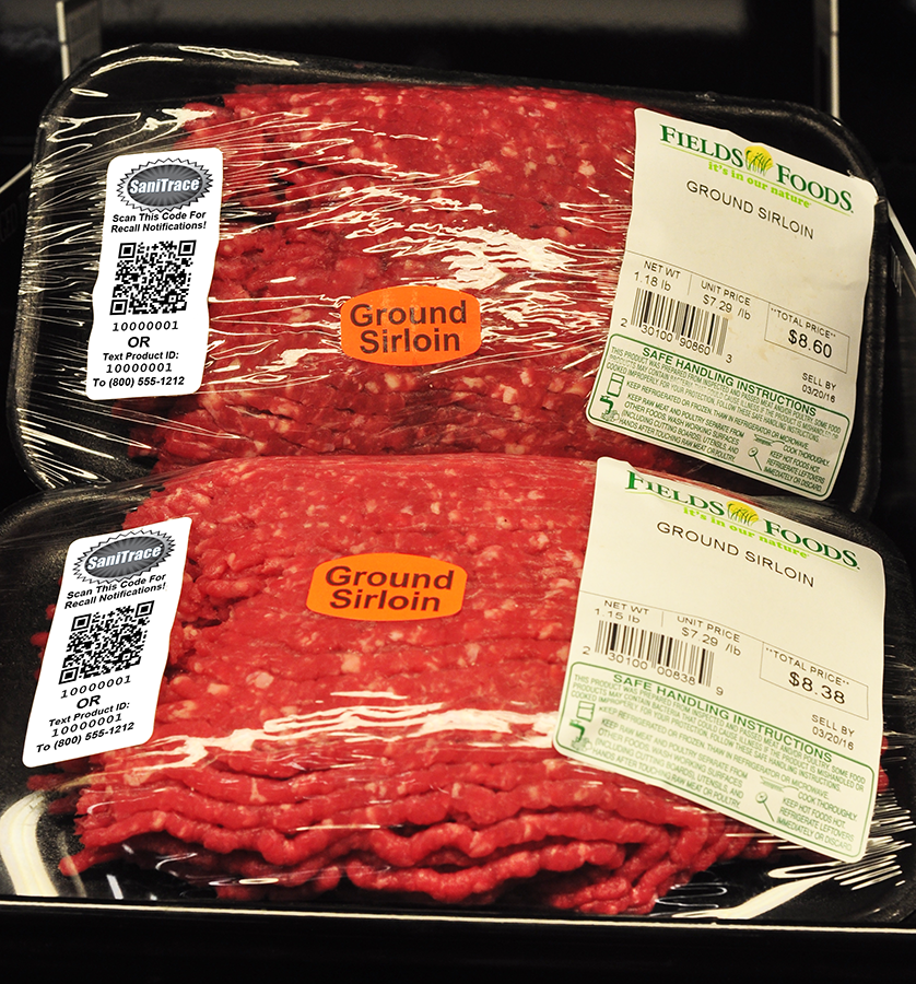 Packages of prewrapped ground beef with the SaniTrace labels.