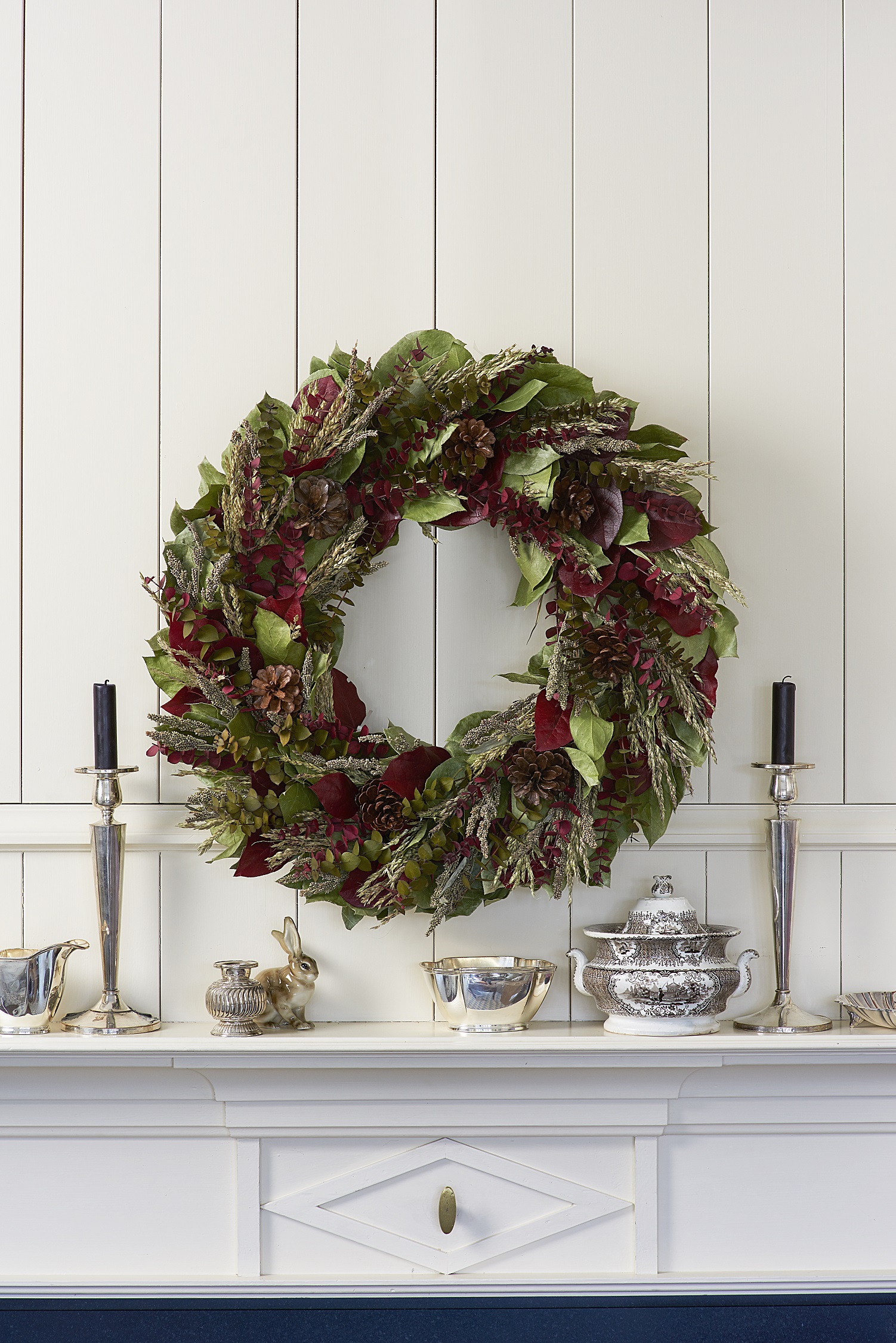 Give instant elegance when you gift this richly colored and textured wreath.