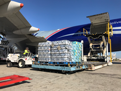 Cargo airplane loading water for FEMA hurricane Maria relief delivery