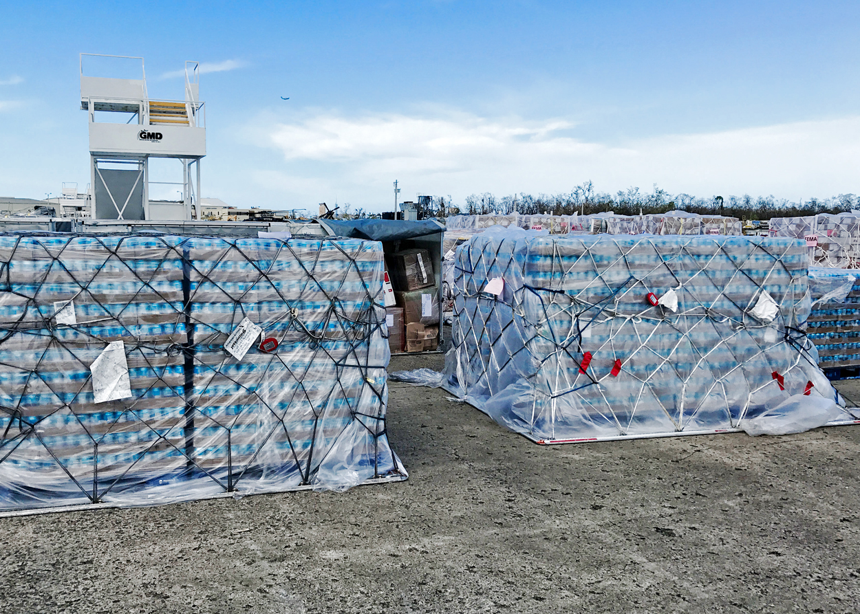 Pallets of CW4K canned drinking water with other Puerto Rico FEMA cargo