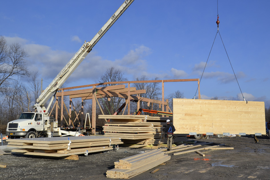 A cross laminated timber (CLT) panel is 'flown' into place during construction of New Energy Works CLT building.