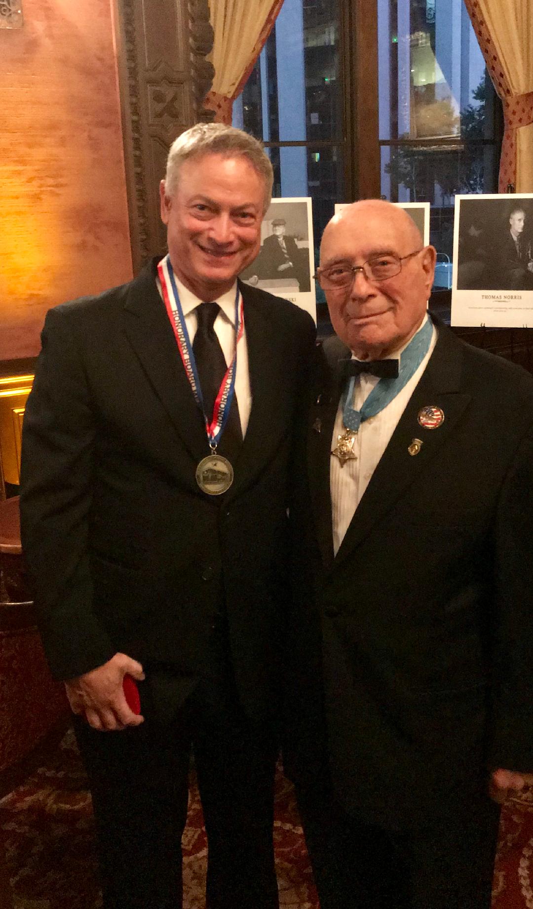 Woody Williams presents Gary Sinise with Honorary Board Member Medallion