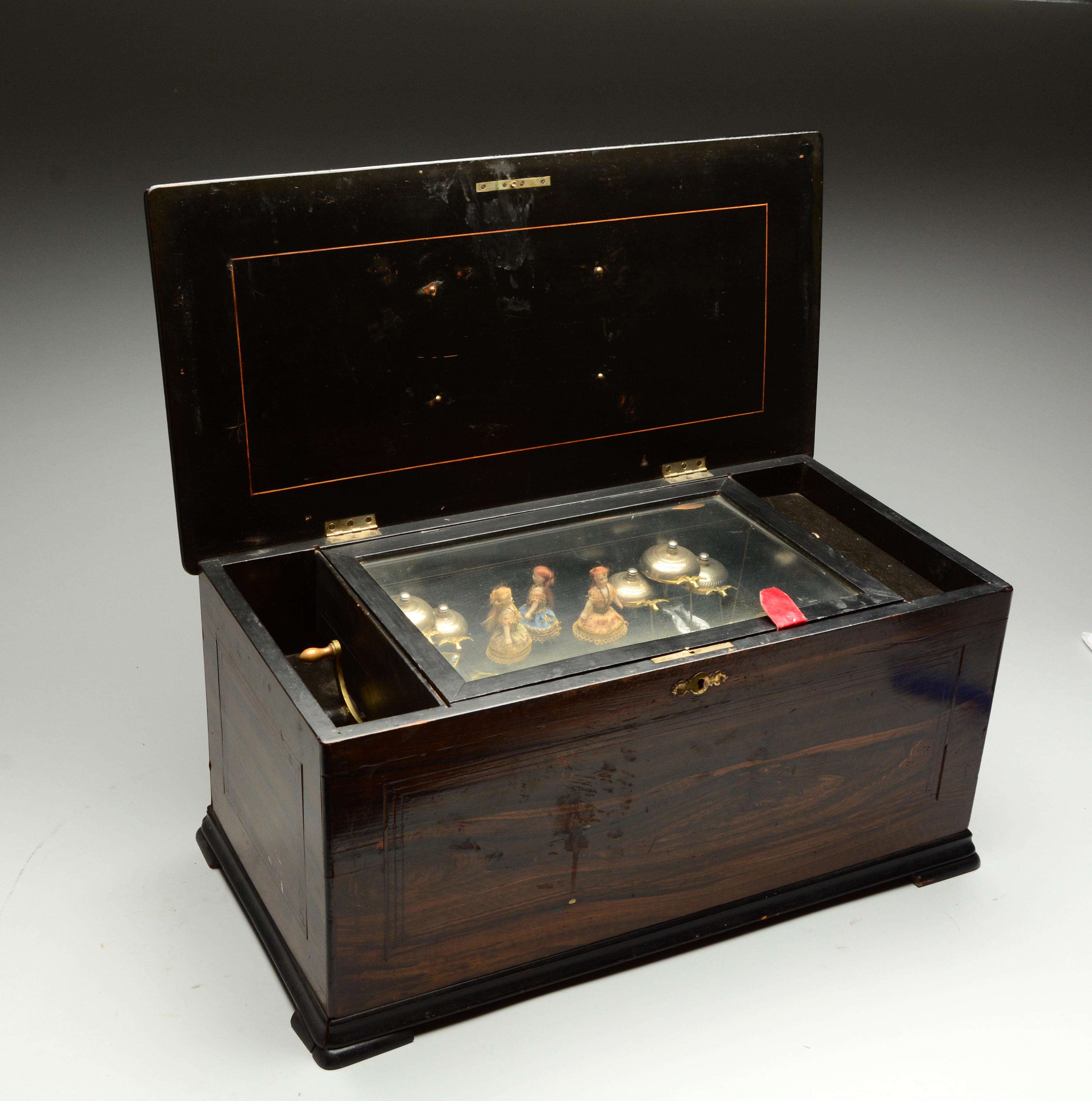 Music Box With Bells, Bird Clappers, and Dolls, estimated at $2,000-4,000.