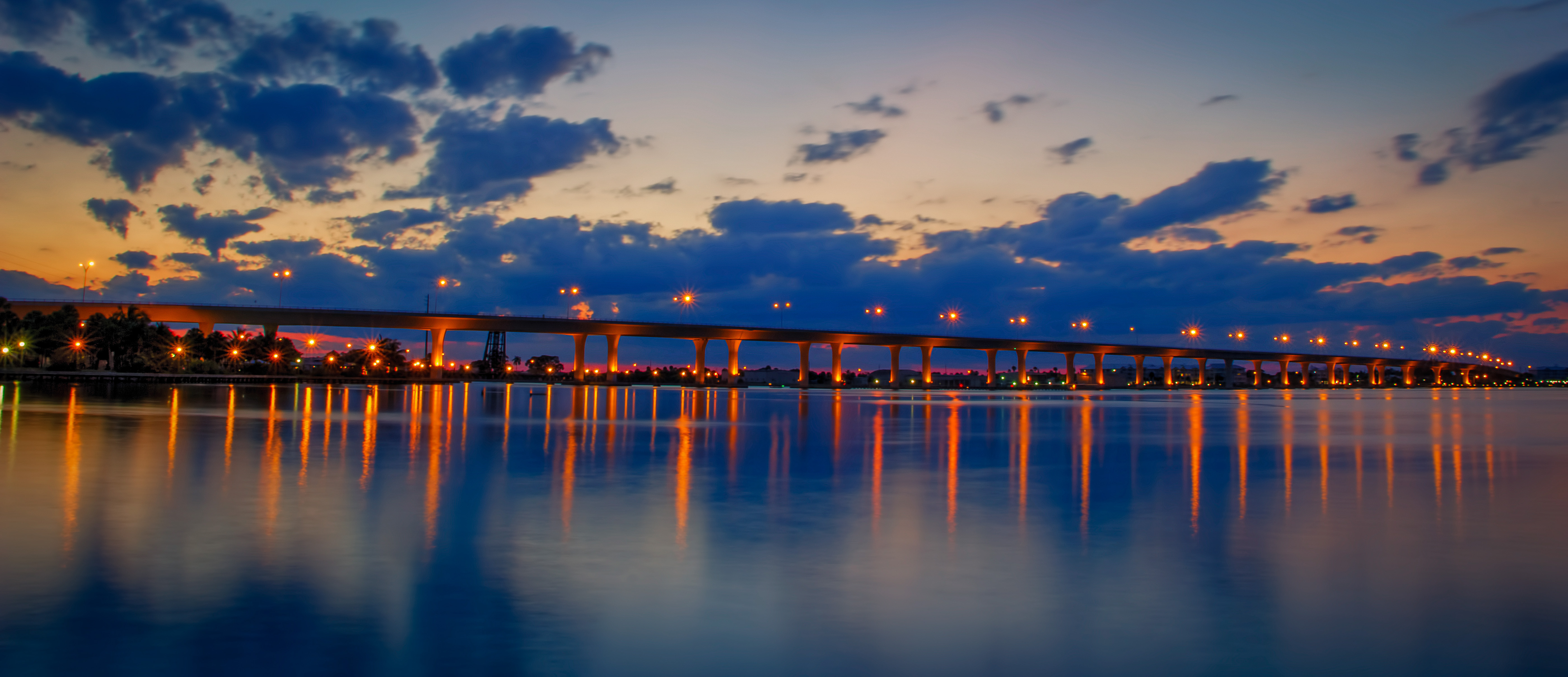 Stuart's Roosevelt Bridge Casts Reflections on the Scenic Saint Lucie River at Seminole Bluff