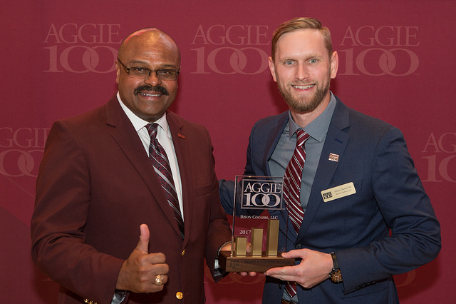 Bison Coolers Co-Owner, Jeremy Denson, receiving Aggie 100 Award