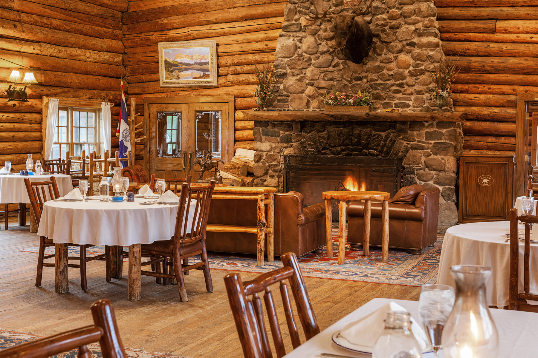 A stay at the all-inclusive Brooks Lake Lodge & Spa in Wyoming features three gourmet home-cooked meals daily in the rustic and elegant historical dining hall before a giant crackling fire.