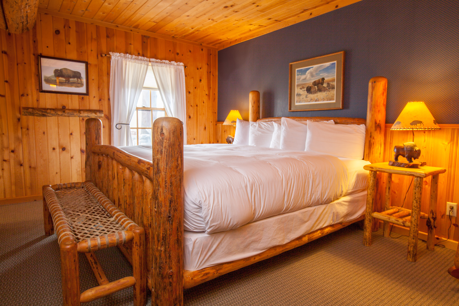 After a long day outside in the snow, Brooks Lake Lodge guests sleep soundly in plush bedding and quiet amenity-filled suites and cabins.