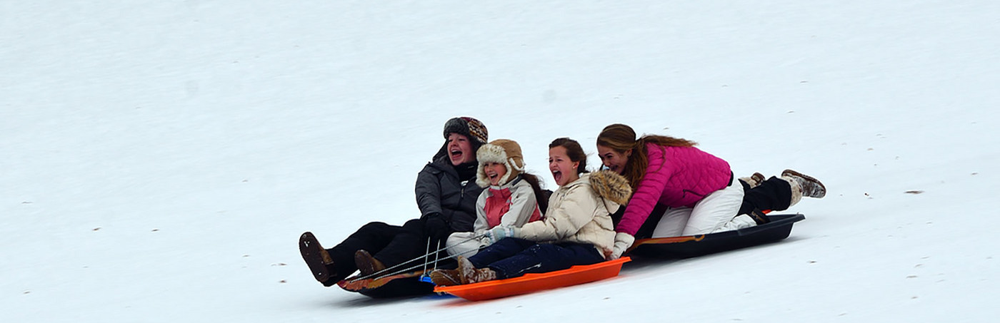 Family sledding at Eagle Ridge Resort and Spa's Nordic Center