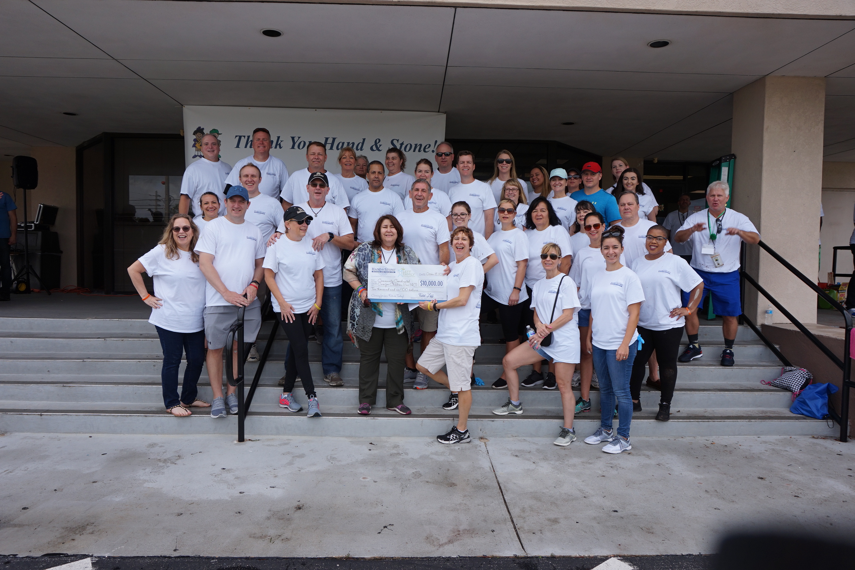 Volunteers from Hand & Stone Massage and Facial Spa kicked-off its National Conference in Orlando on Wednesday, Oct. 18, 2017, with a community service project at 4C Florida