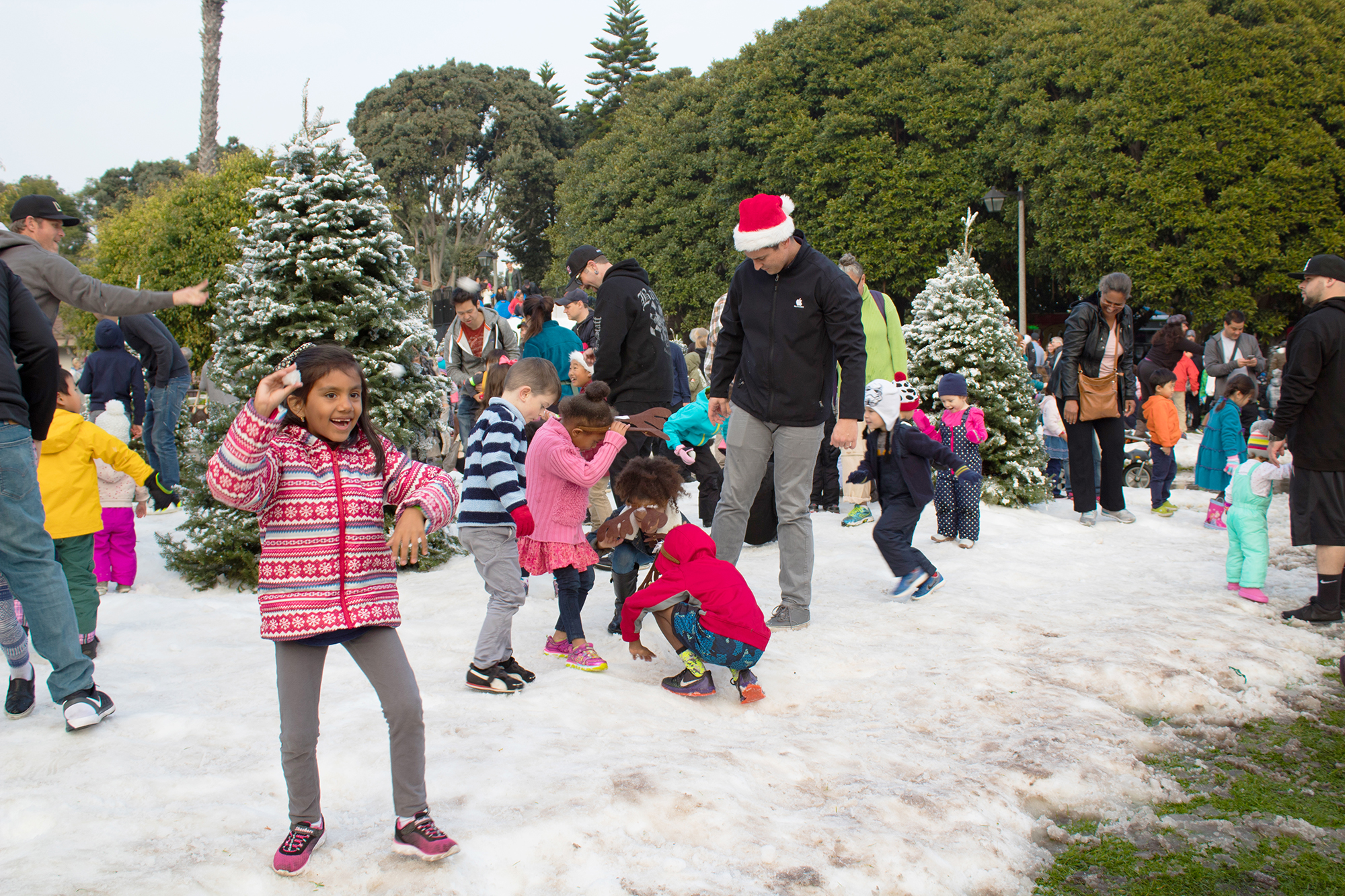 Snow Wonder transforms Marina del Rey's Burton Chace Park into a winter wonderland with 80 tons of real snow used to create a sledding hill and snow-kissed pine forest.