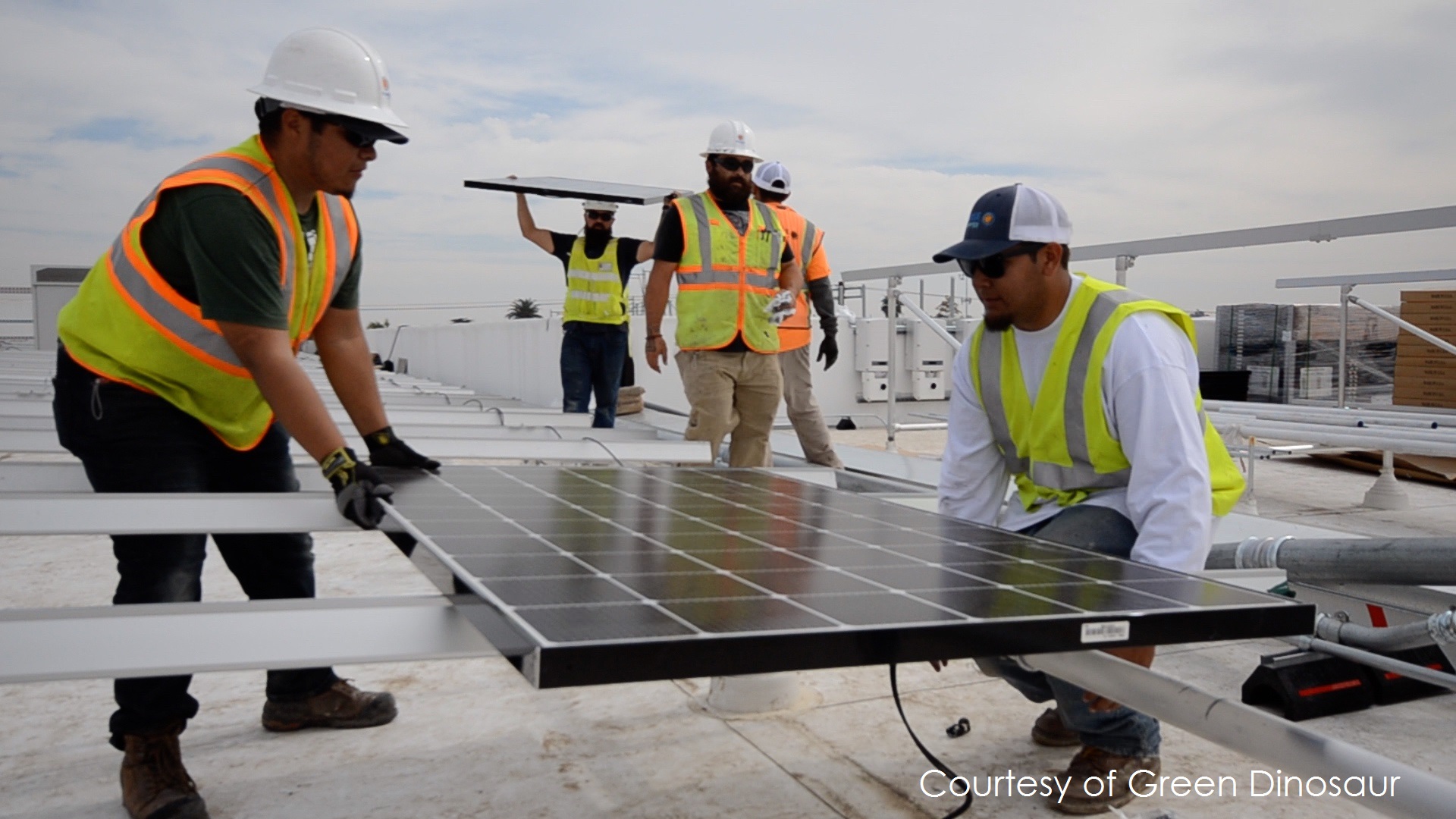 Promise crew installing solar panels on the roof.