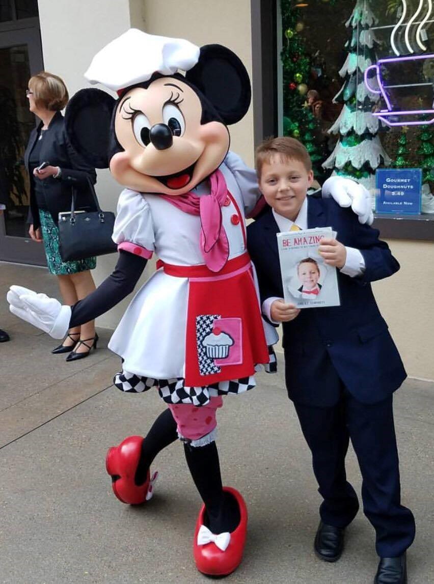 Author John Humphreys Presents Minnie Mouse with BE AMAZING Book Published by Beyond Publishing at Disney
