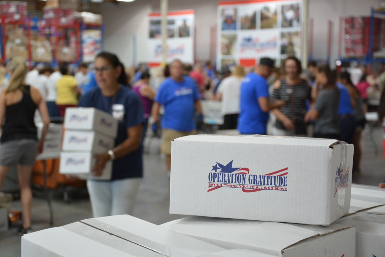 Operation Gratitude Care Packages with Volunteers in Background
