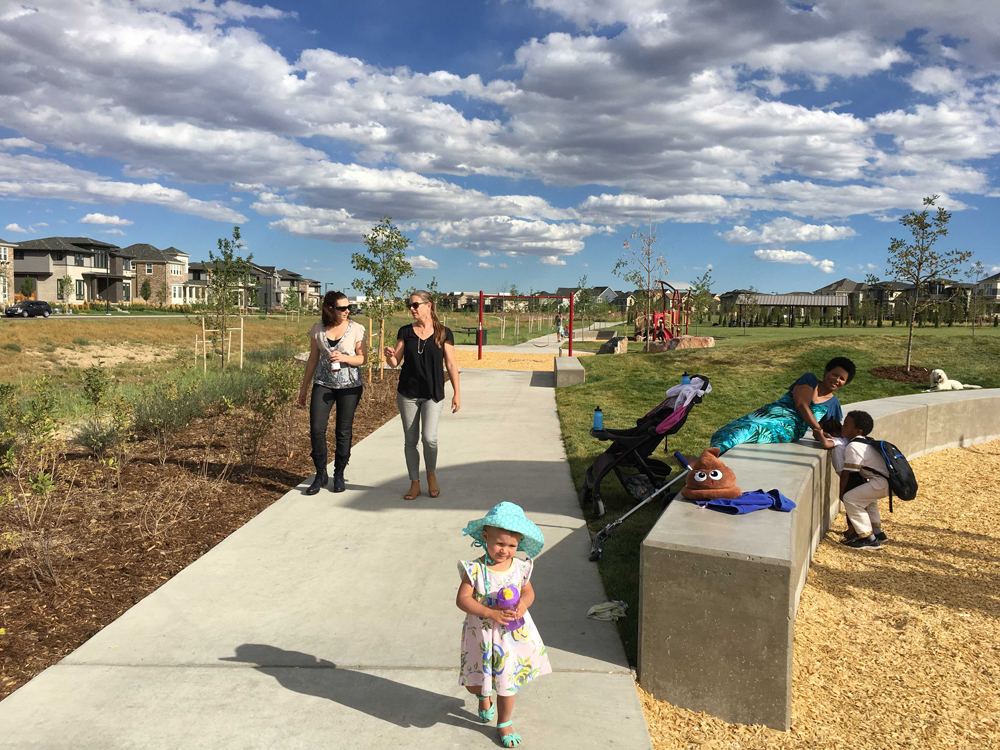 “Play Pods” accentuate the arcing walkway that divides the native drainage way and the large turf field through Cottonwood Gallery, one of the recently opened Civitas-designed parks in Denver.