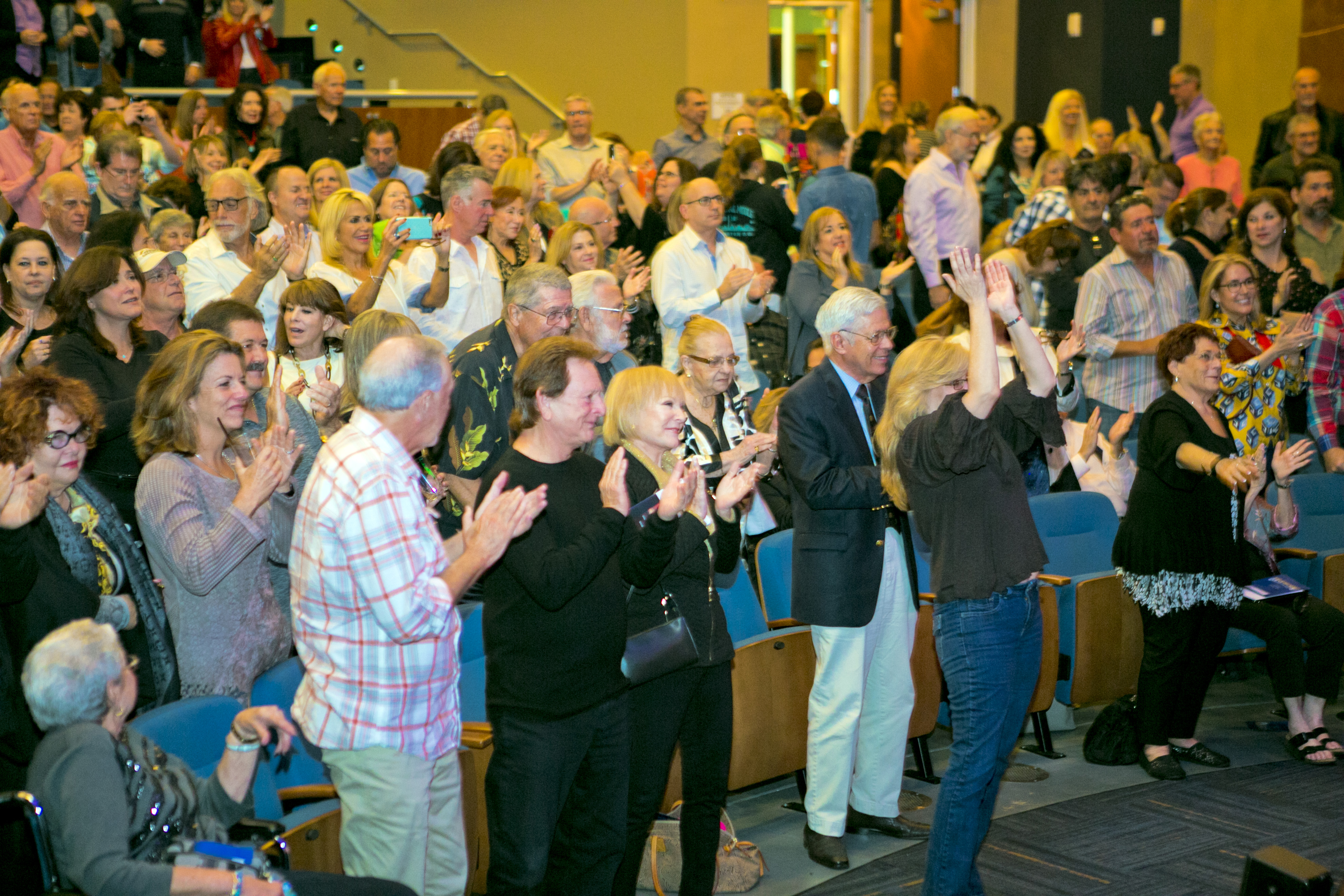 Audience enjoying the performance with a standing ovation