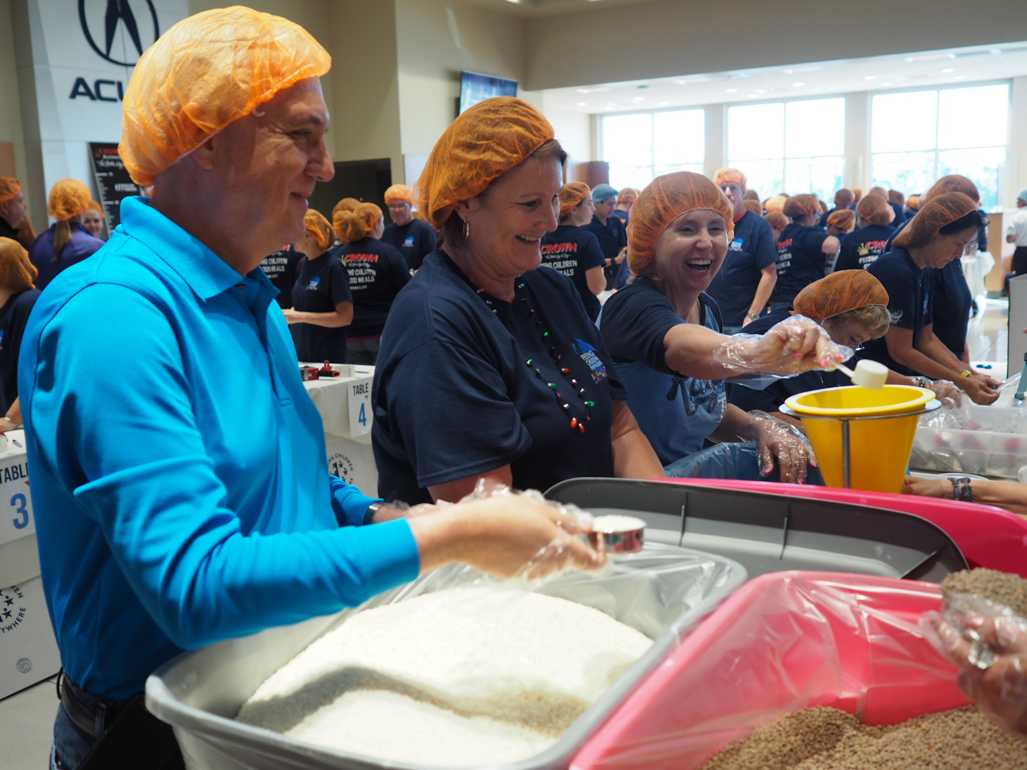 Crown Automotive Group Packaged Over 100,000 Meals For Feeding Children Everywhere