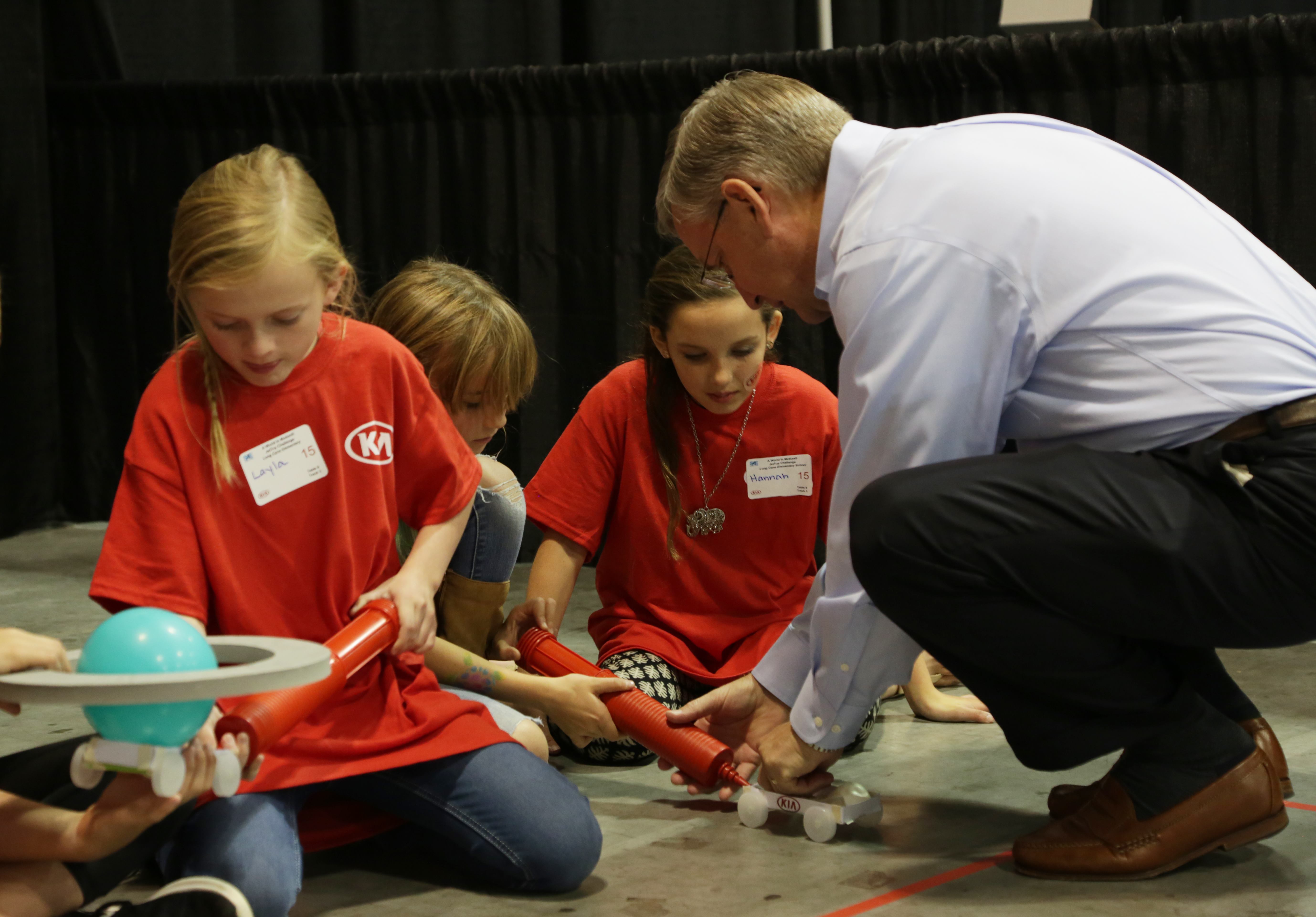 Students from Long Cane Elementary in Troup Co. prepare to launch their JetToy with guidance from Stuart C. Countess, CAO, KMMG.