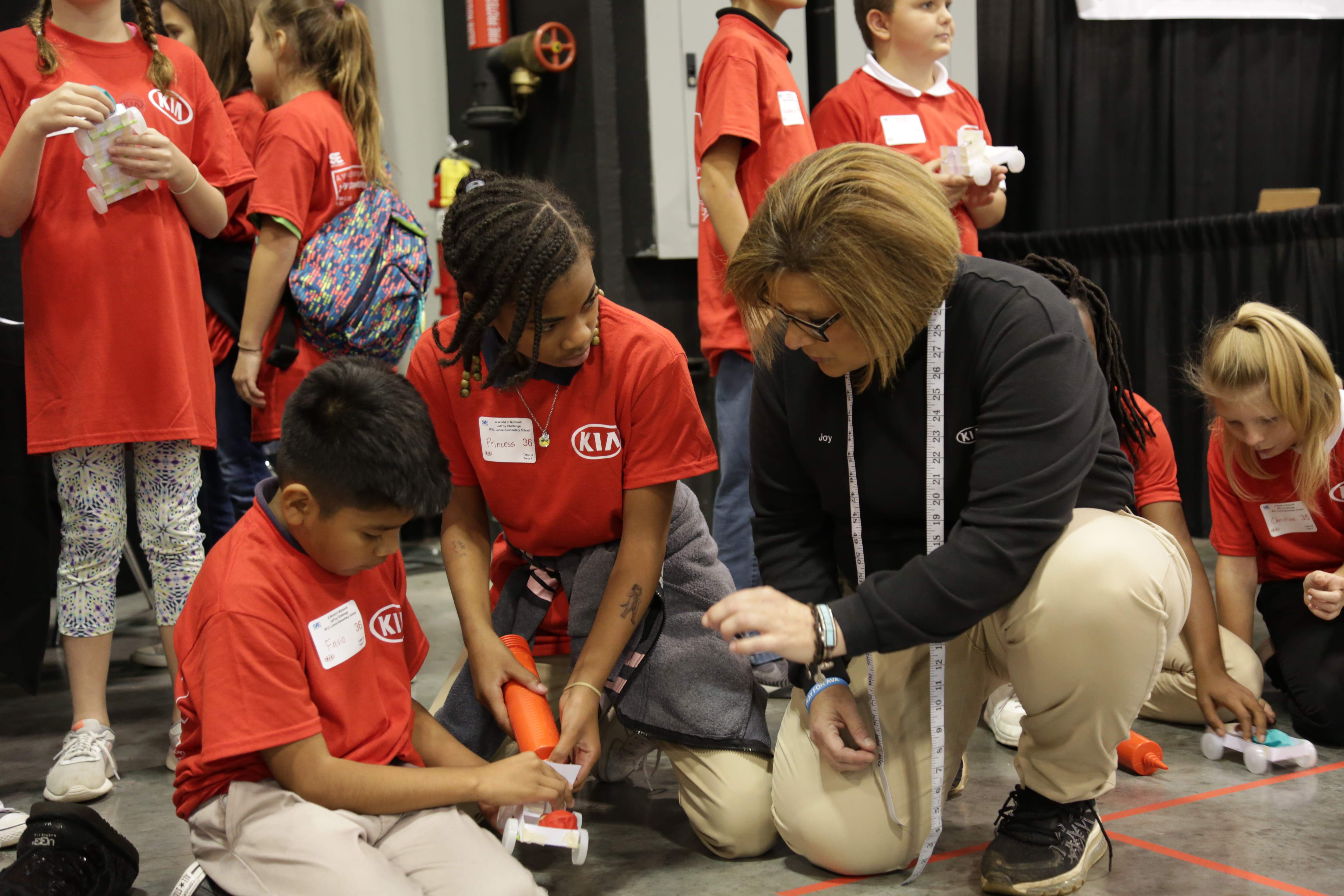 W.O. Lance Elementary students from Lanett City Schools prepare to launch their JetToy as KMMG volunteer Joy Johnston provides instruction.