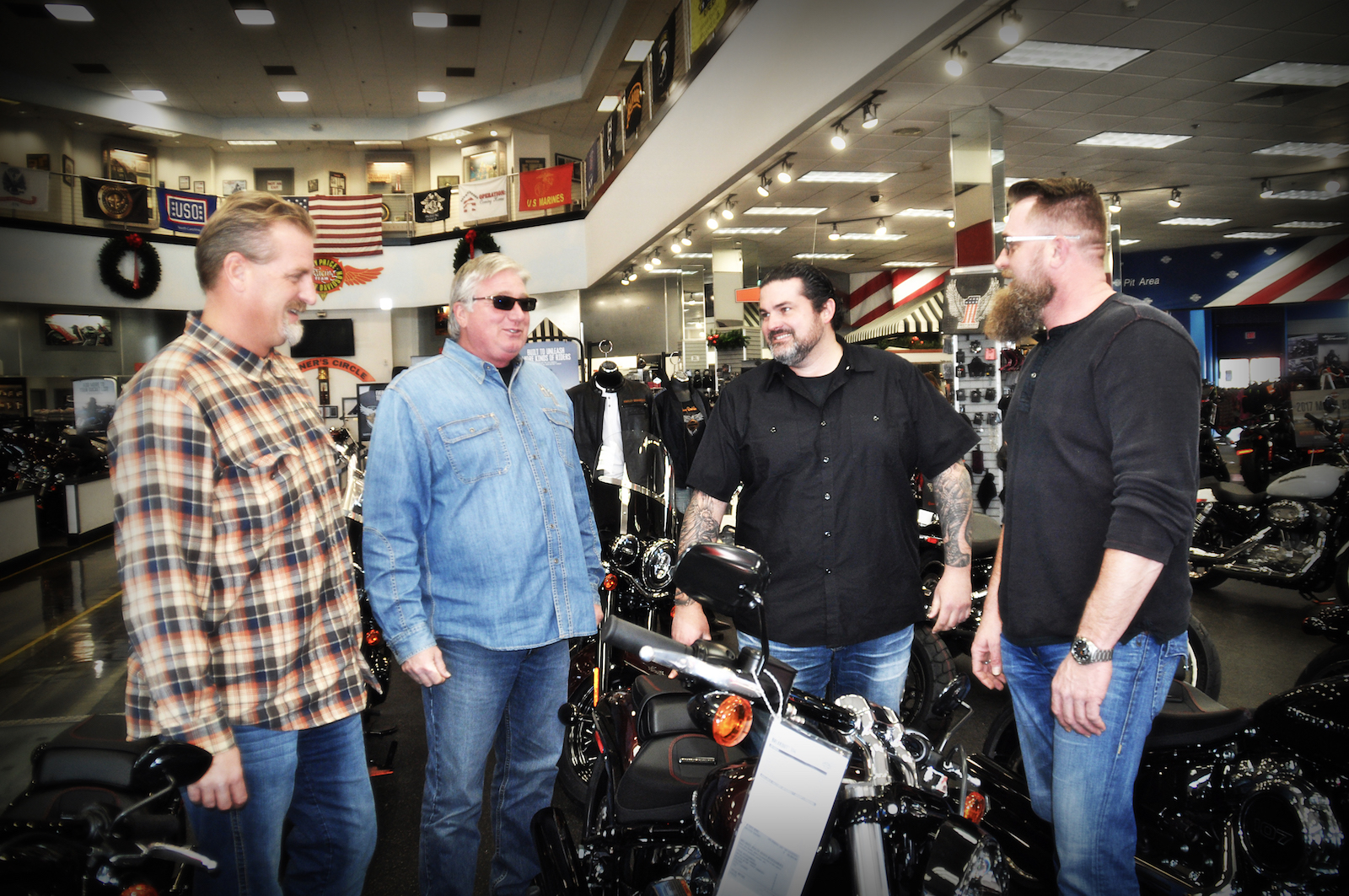 Ray Price Harley-Davidson's new owner is John Morotti, shown here second from left with his general management team.