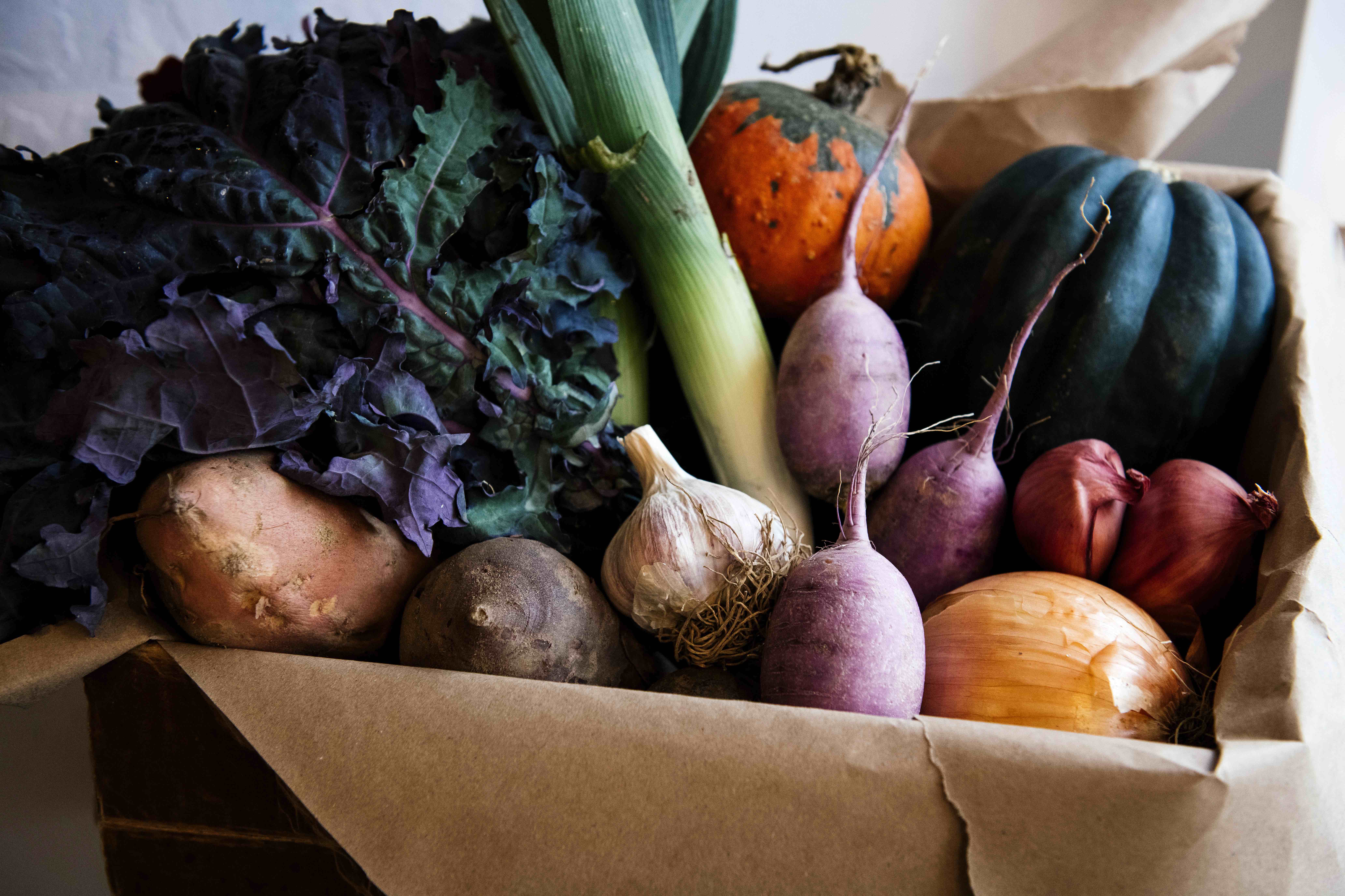 Farm-fresh seasonal produce is available at The Farmer's Hand. Holiday dinner boxes include a variety of staples.