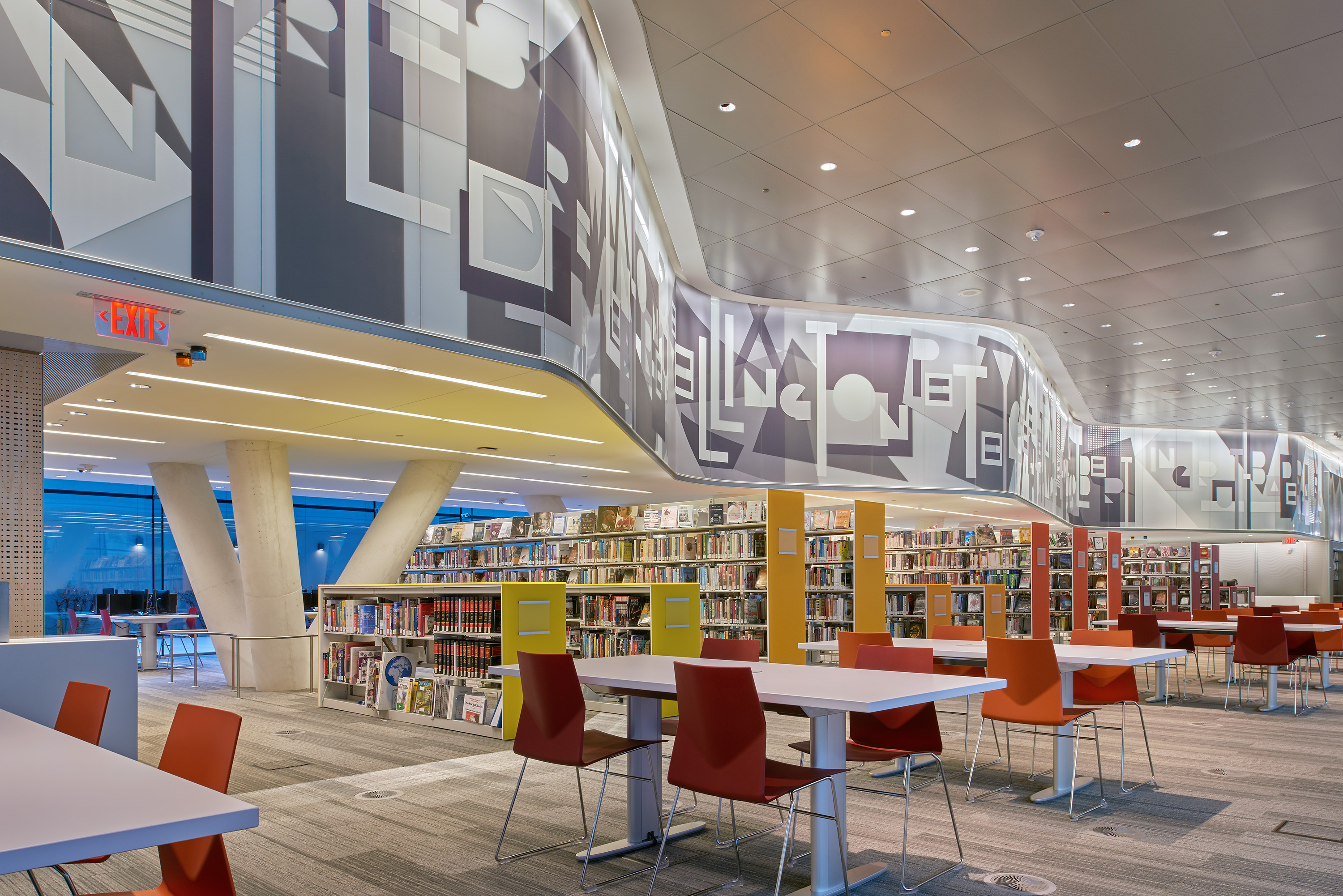 The library space seamlessly integrates with the building design.