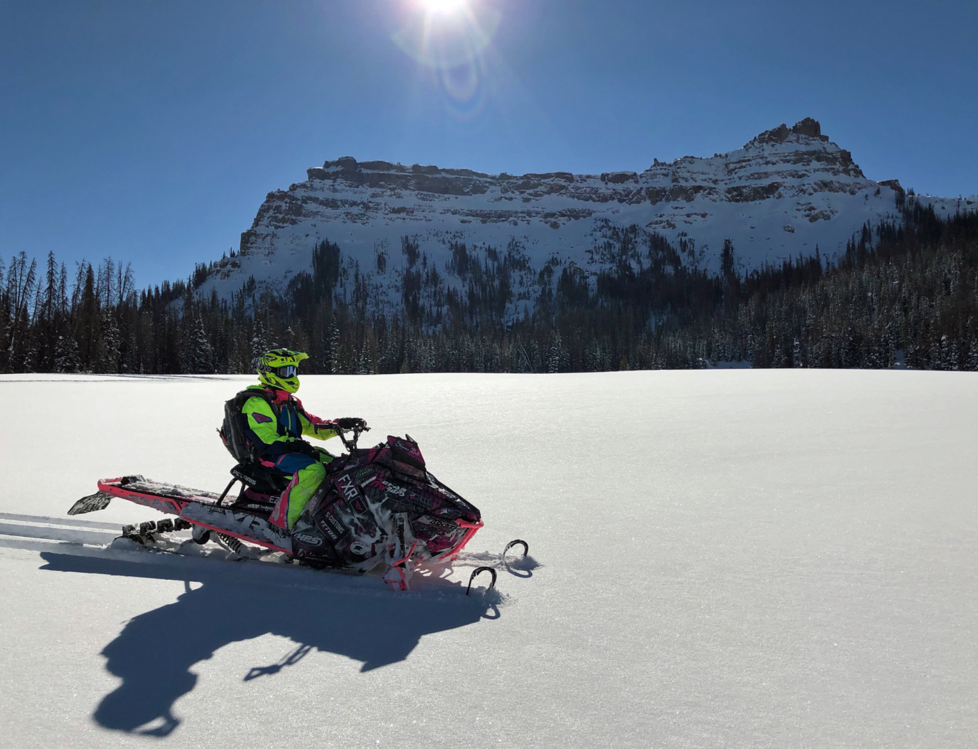 Guests of Brooks Lake Lodge & Spa can enjoy a variety of included winter activities such as snowmobiling around the nearly two million acres of snowy and scenic terrain.