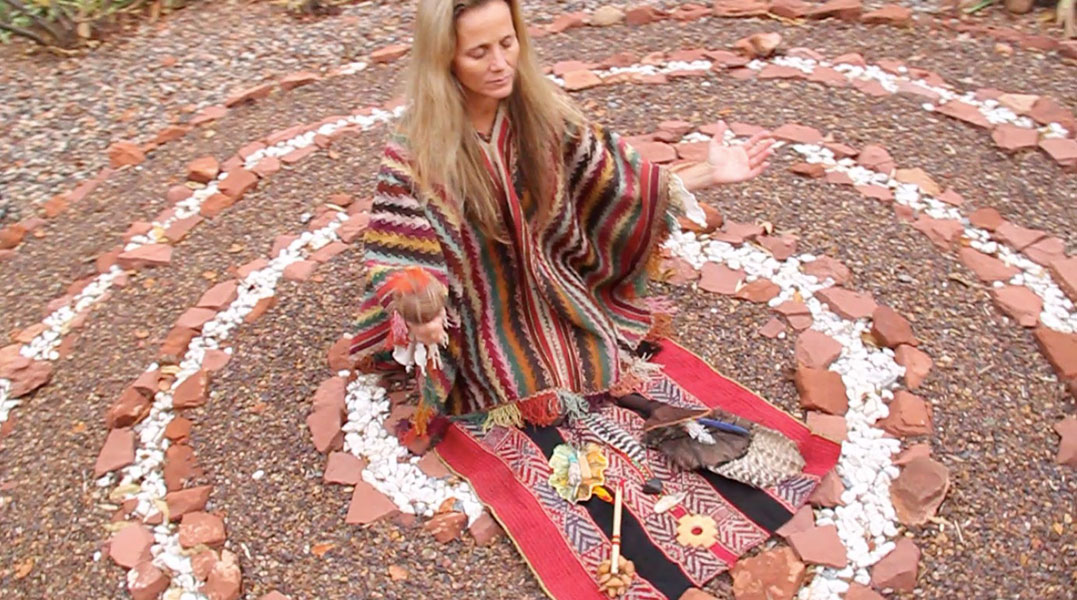 Shamanic healer Anahata Ananda doing ceremony in a spiral Sedona vortex.