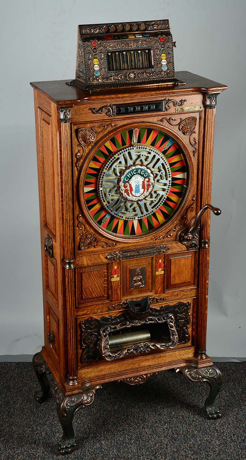 5¢ Mills Two Bits Chicago Musical Upright Slot Machine, estimated at $20,000-30,000.
