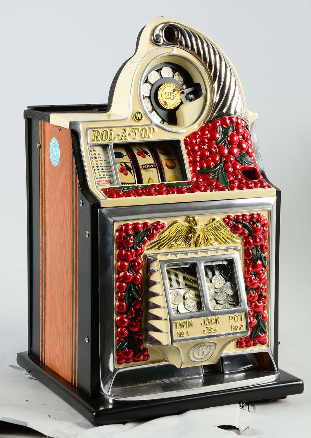 25¢ Watling Cherry Front Slot Machine, Estimated at $7,000-10,000.