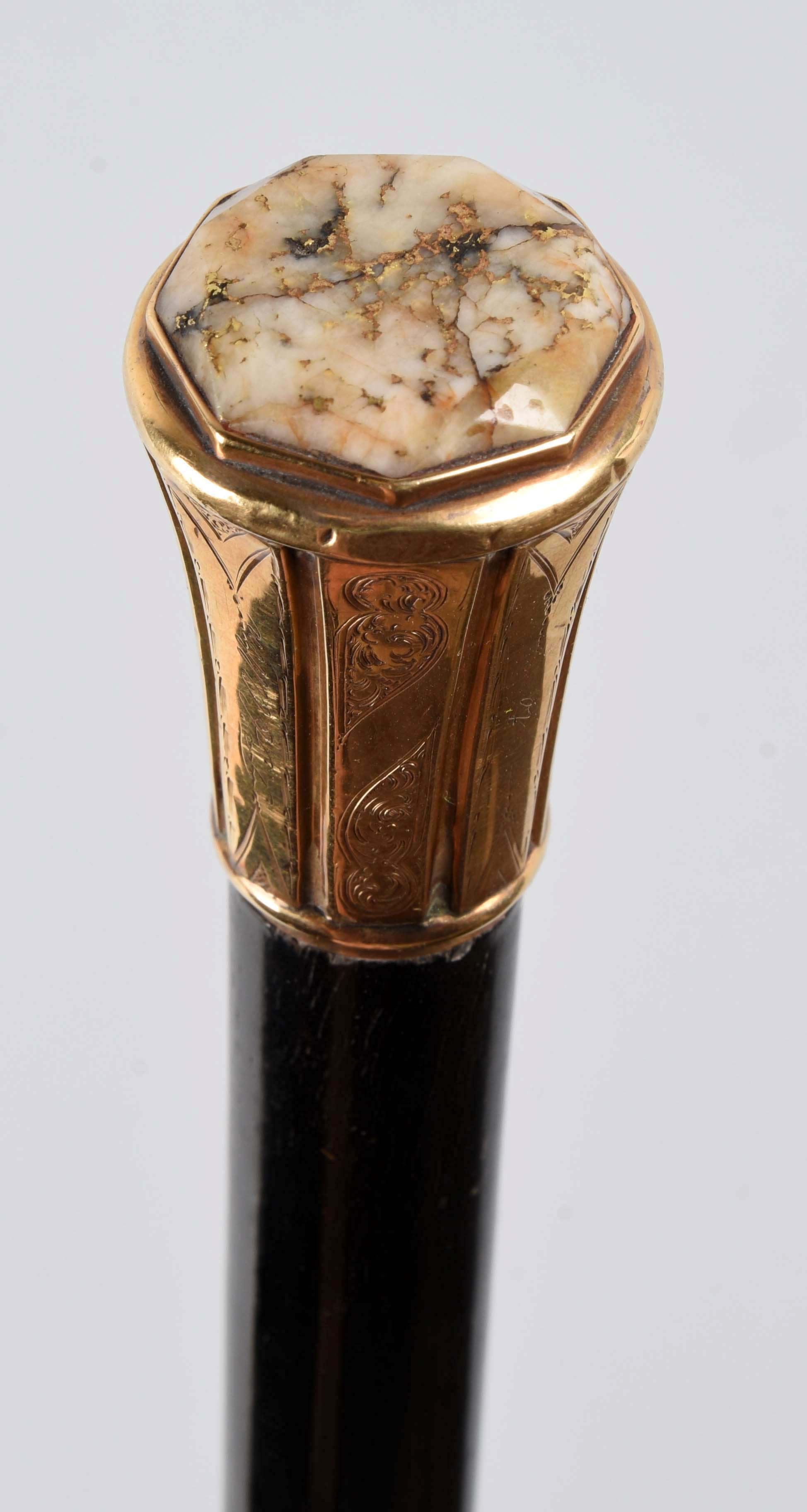 Walking Stick with Gold & Gold Quartz Handle, Estimated at $5,000-10,000.