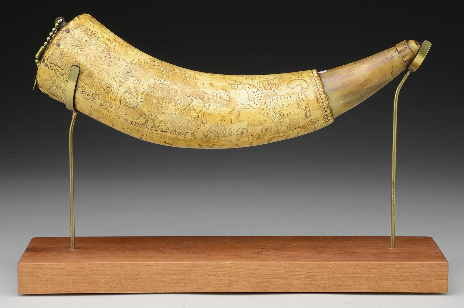 Fine Identified French and Indian War Powder Horn of Moses Walcut, Fort Edwards, 1758, estimated at $8,000-12,000.