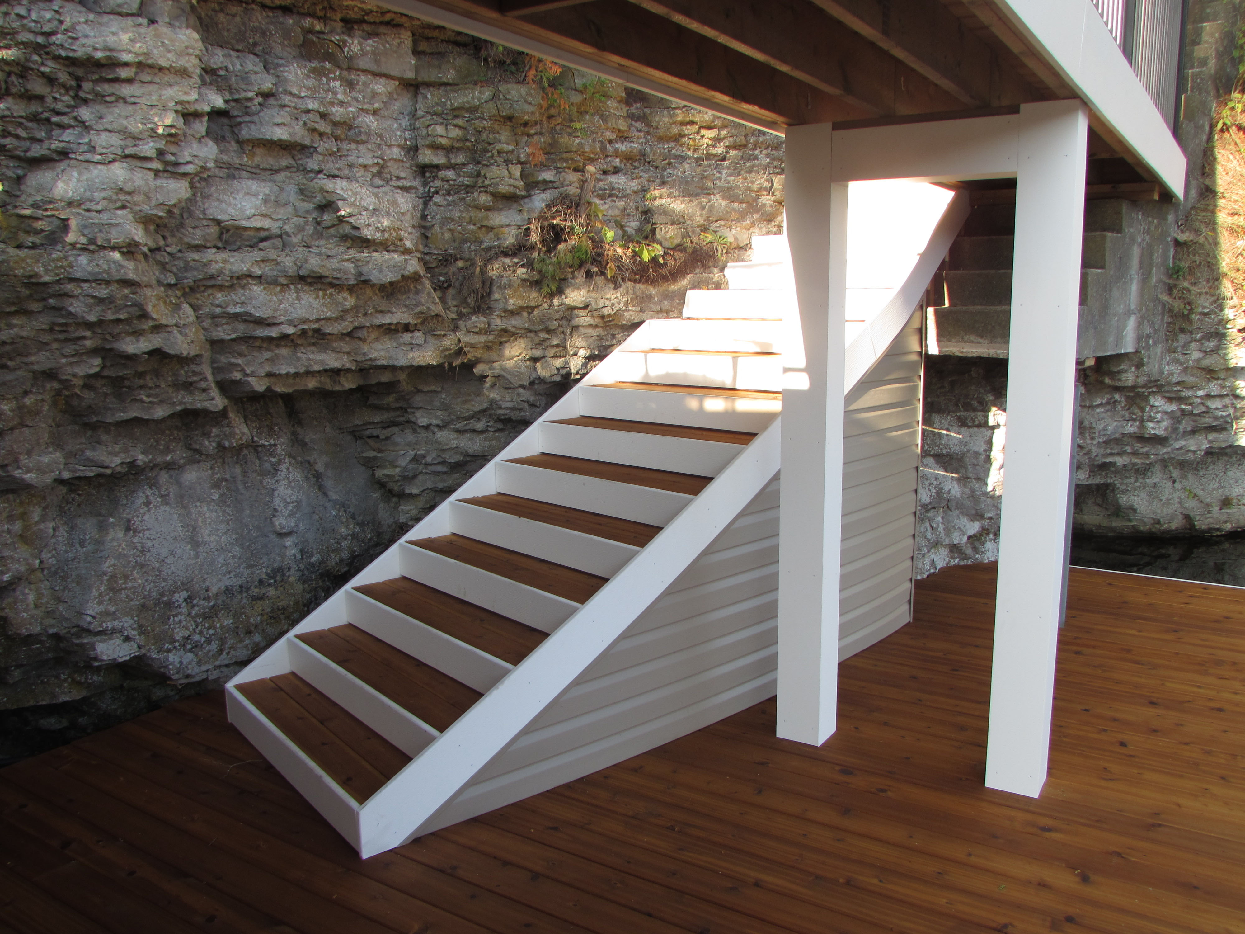 Witt's Woods & Greens engineered a boat dock into the natural setting of a rocky cliff.