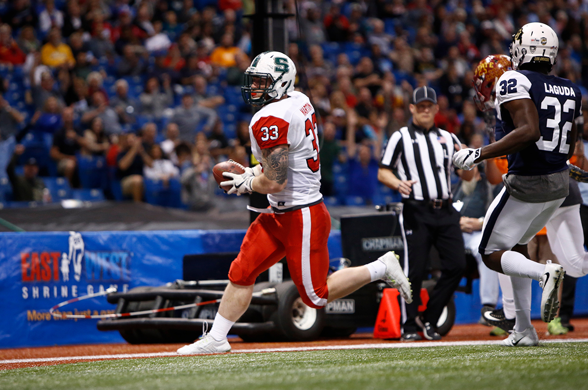 Marcus Martin (Slippery Rock) hauls in a 4-yard touchdown pass for the East squad with 2:02 left in the third quarter of the 93rd East West Shrine Game at Tropicana Field in St. Petersburg, Fla.