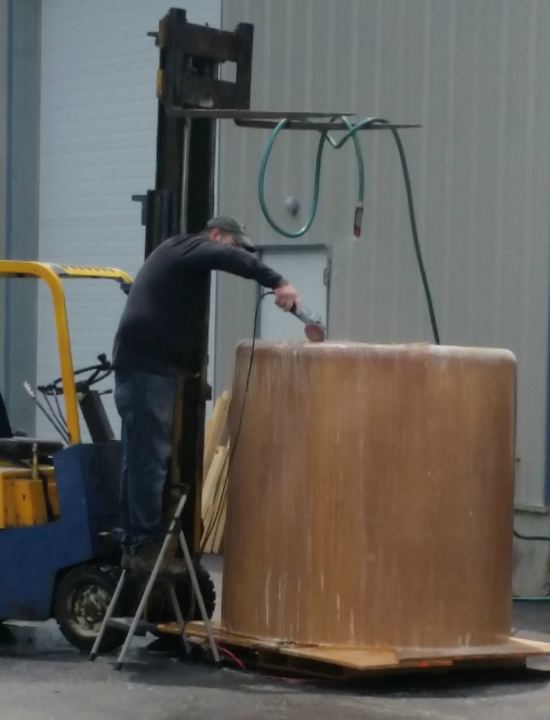 American Fiberglass Tank Repair technician making custom tank in our fabrication facility.