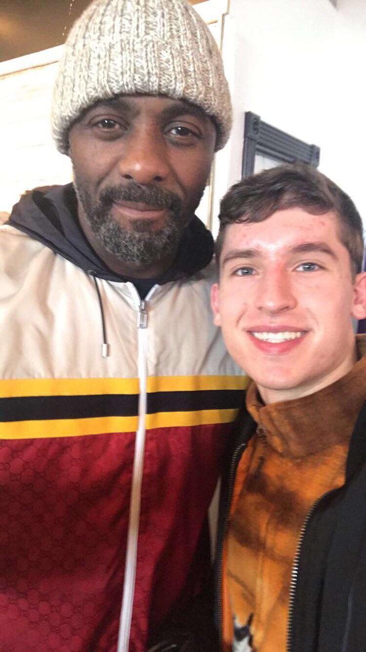 Logen Pickett of 3Dimensional snaps a selfie with actor Idris Elba at the Music Lodge during the 2018 Sundance Film Festival