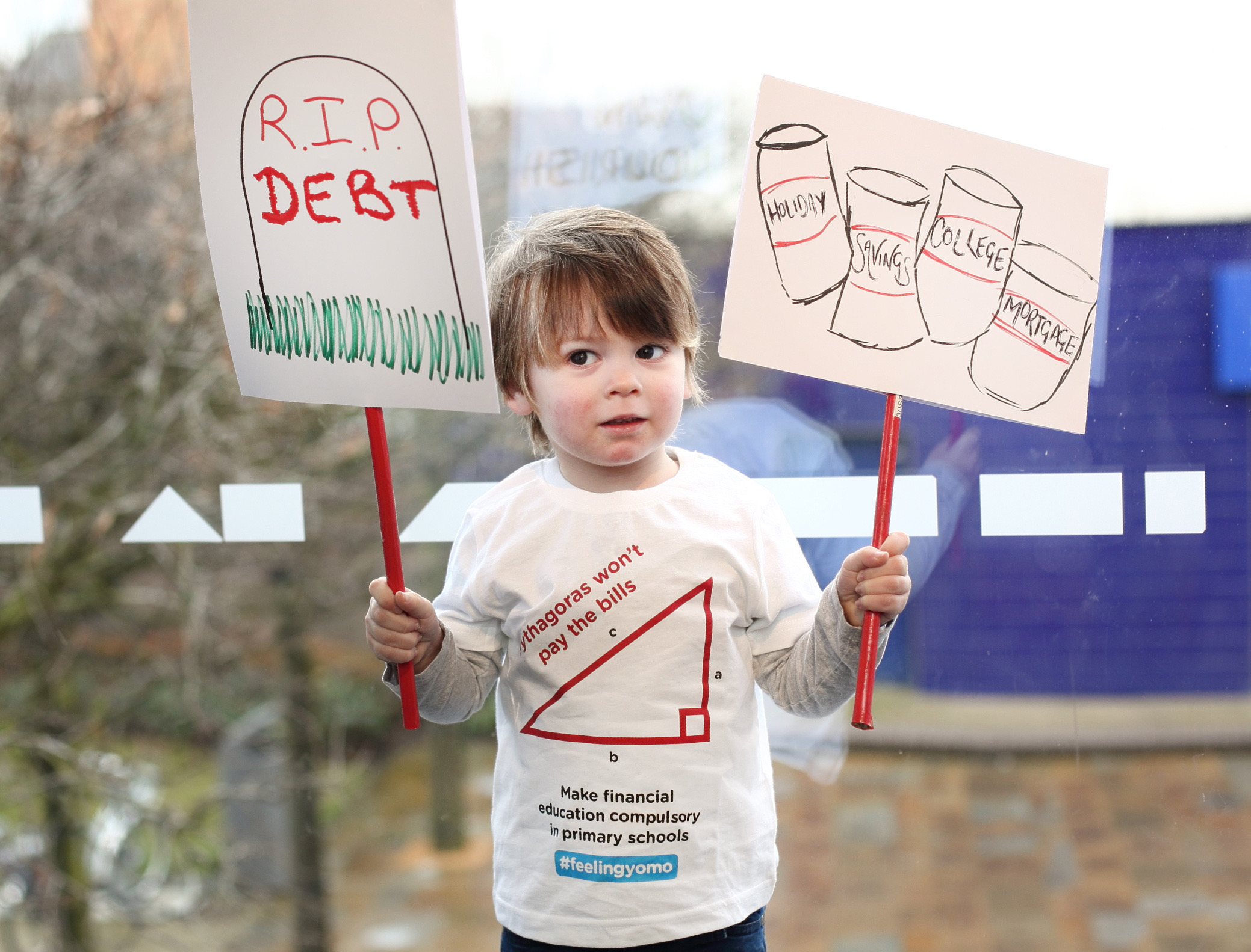 Sebastion Duncan (aged 2) protests to make financial education compulsory in UK primary schools