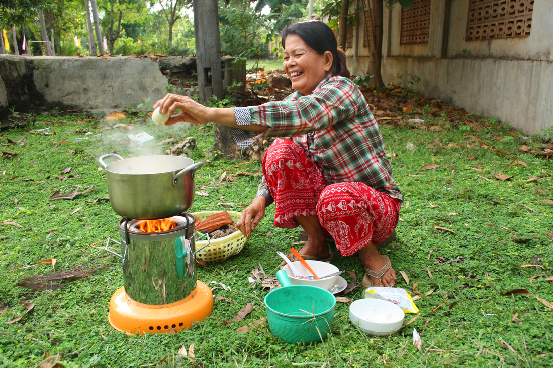 An African Clean Energy Customer in Cambodia with her ACE 1 Cookstove.