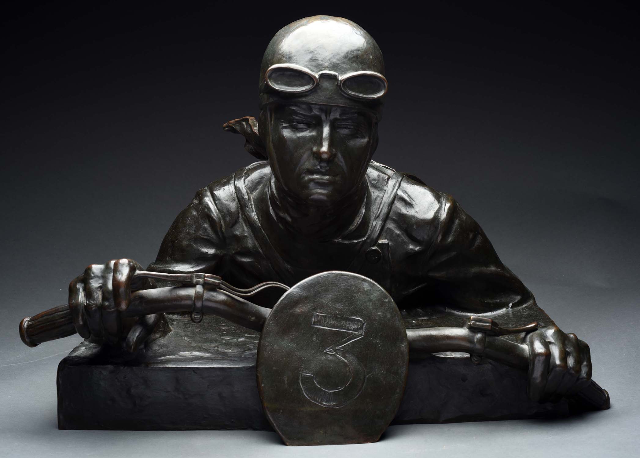 Bronze Bust of Motorcycle Racer, estimated at $4,000-6,000.