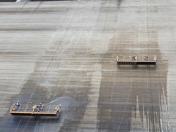 Getting prepared: The surface of the Jucazinho Dam is cleaned prior to a treatment with PENETRON topical waterproofing products to ensure a seamless repair job – just in time for the rainy season.