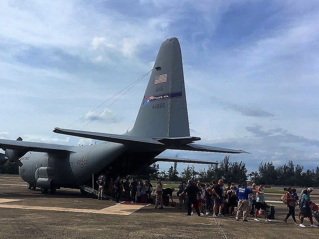 Line up of people waiting to be evacuated