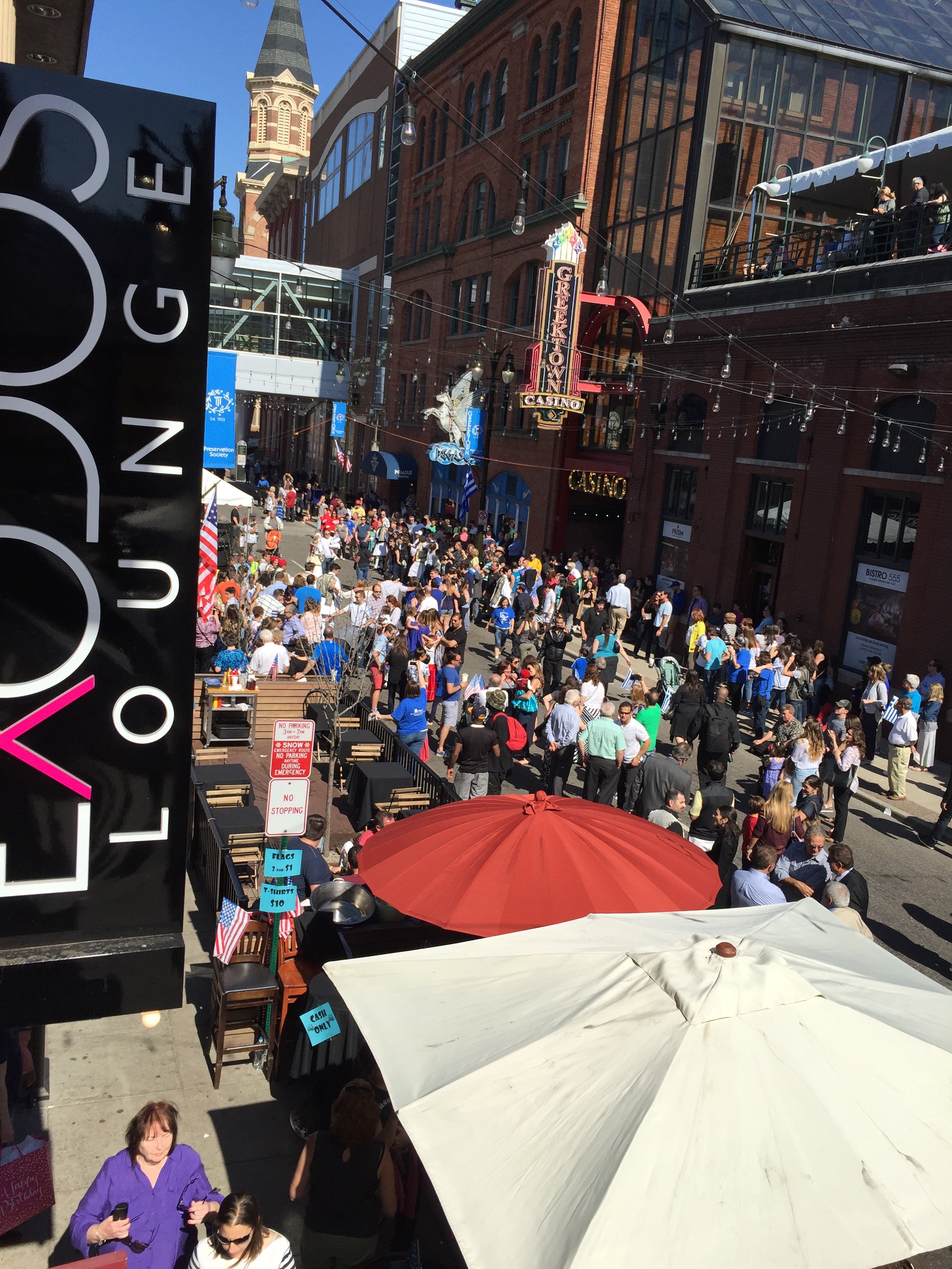 Parade-goers dance in the streets of Greektown in downtown Detroit, following the annual Detroit Greek Independence Day Parade.