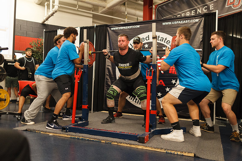 Competitors in last year's powerlifting competition held in the weight room of Liberty University's Football Operations Center set many Commonwealth Games records.
