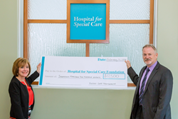 Kelser Corporation President and CEO Barry Kelly (right) presents check to Hospital for Special Care President and CEO Lynn Ricci (left) on behalf of the Kelser Foundation.