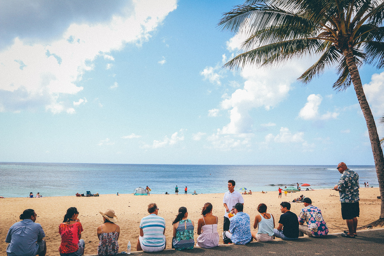 Watching surfers at Sunset Beach on Oahu's North Shore