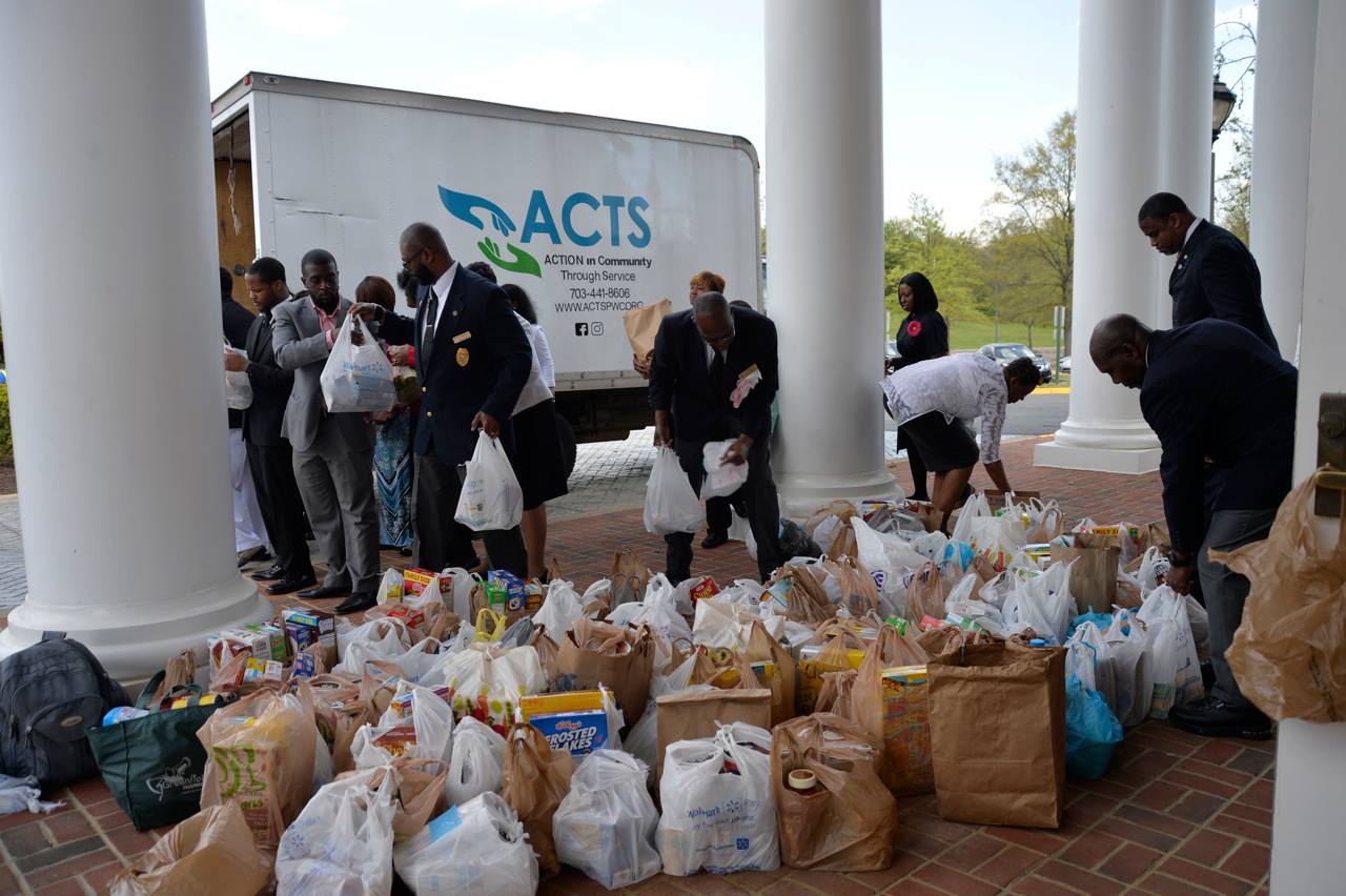 Loading Donated Food Items Into ACTS Truck