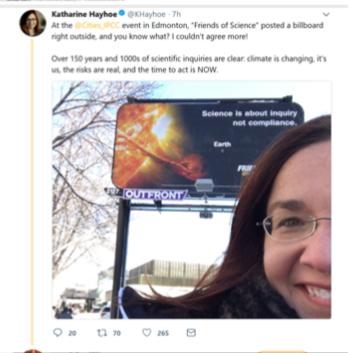 Dr. Katharine Hayhoe's selfie with Friends of Science Society's climate change billboard