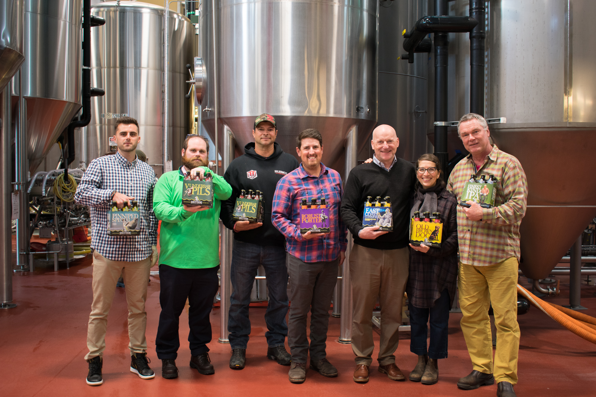 New owners of Smuttynose Brewing Company celebrate with the company founders