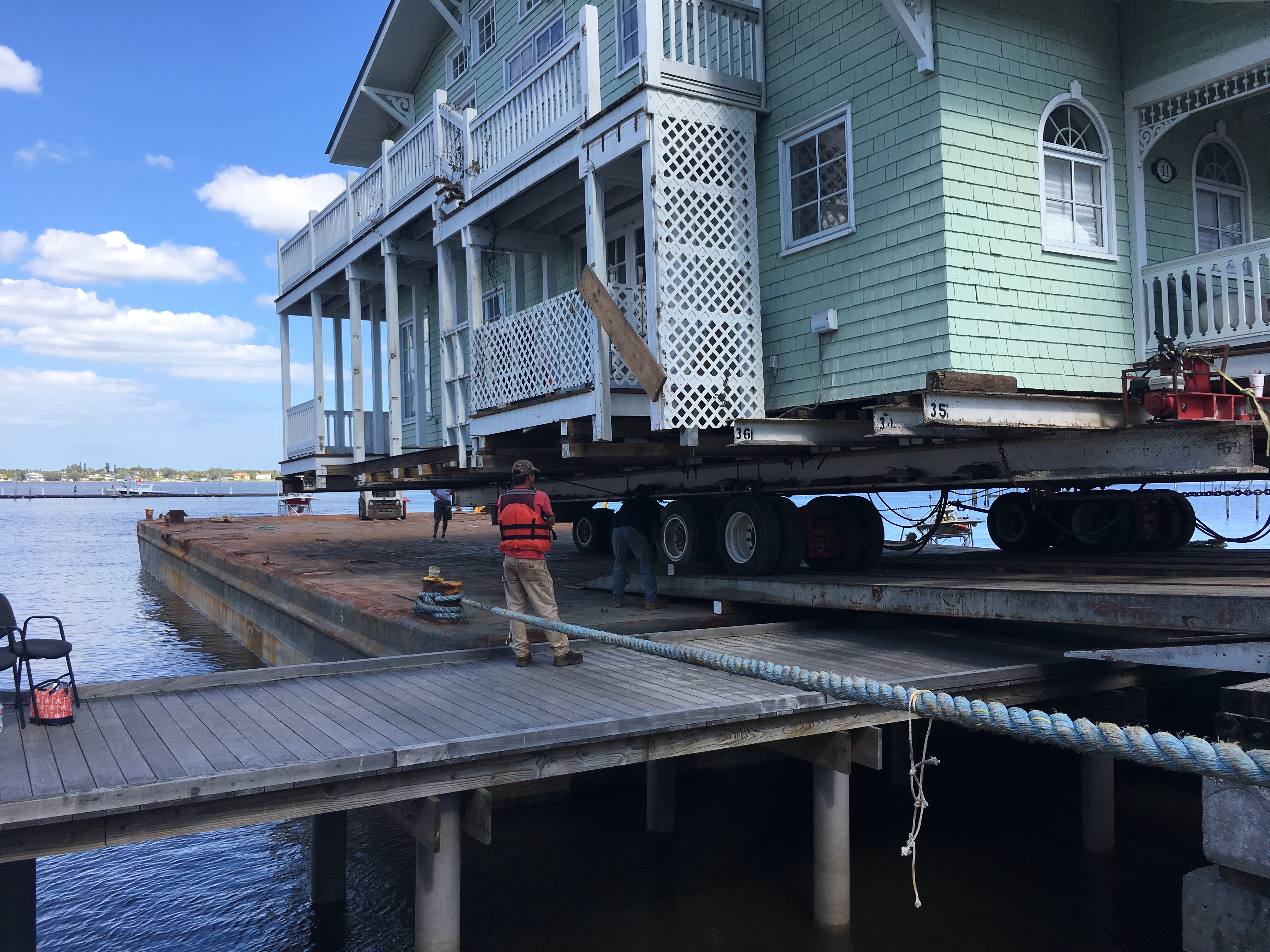 The historic Clifton Fishing Lodge was carefully loaded onto a barge and moved nearby to make room for Seminole Bluff
