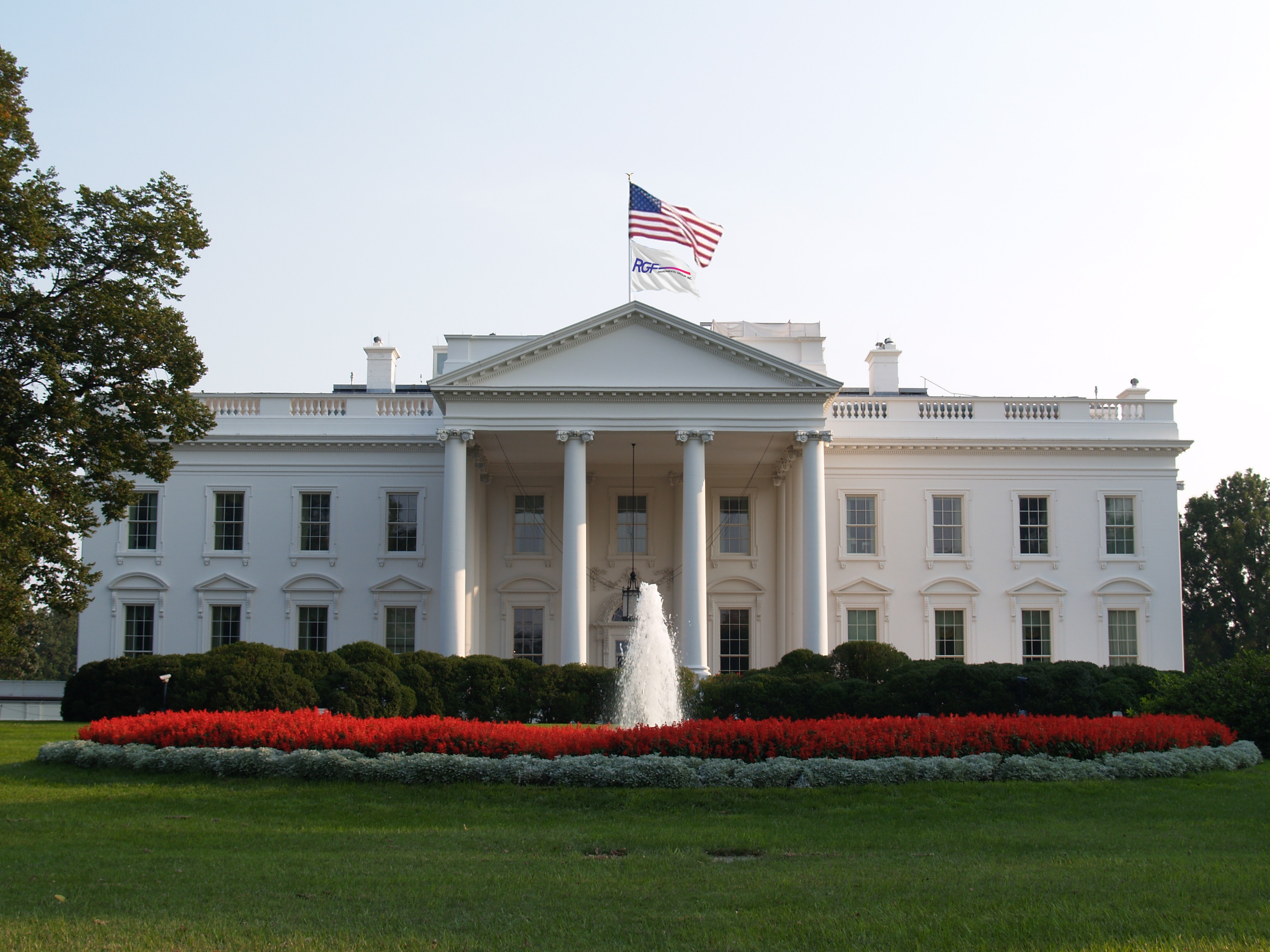 The White House with American and RGF Flags