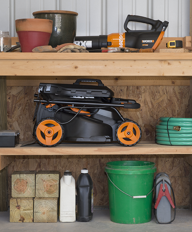 The compact WORX 20V, 14 in. Lawnmower stores easily under a work table or in a garage corner.
